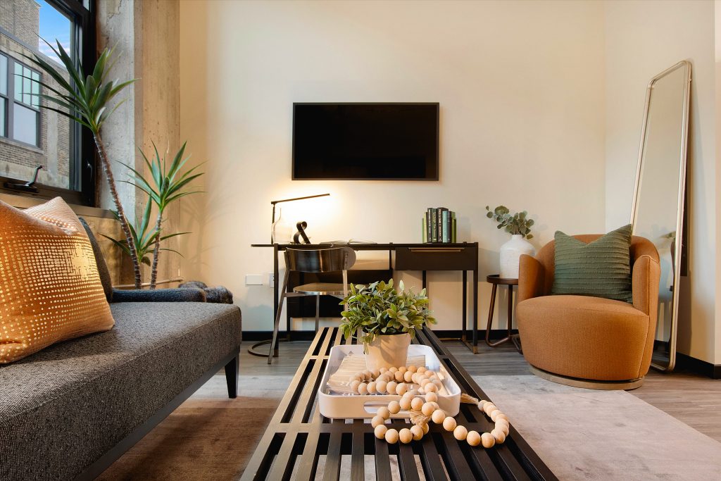 A living room in a studio unit at The Ludlow.